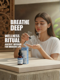 A woman performing a wellness ritual by inhaling Swas Anjali drops from her palm for deep breathing support.