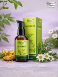 Trinabha Ayurvedic Dandruff Hair Oil bottle and box with neem leaves and white flowers for healthy scalp.