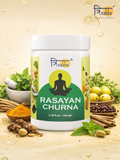 Trinabha Ayurvedic Rasayan Churna 100g bottle surrounded by fresh herbs, amla, and turmeric.