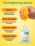 Infographic showing a hand squeezing a fresh orange into the serum bottle. Highlights include Vitamin C for radiance, Green Tea Extract for protection, Ayurvedic Herbs for balance, and Hyaluronic Acid for hydration