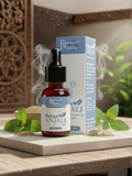 Product shot of Swas Anjali dropper bottle and its blue-and-white outer box packaging on a wooden surface.